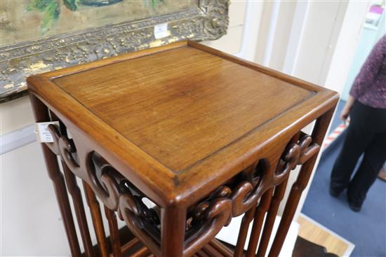 A quartetto of Chinese hardwood occasional tables, the square tops with pierced scrolled friezes